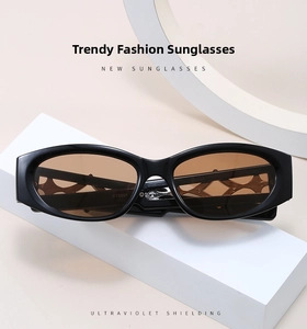 Detailed macro view of trendy Y2K sunglasses featuring hollow geometric temple patterns