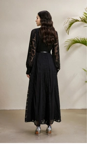 Detailed back view of a black lace long-sleeve dress with elegant embroidery and slim belt