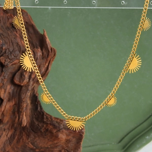 Minimalist 18K gold plated titanium steel necklace featuring seven sun charms on O-chain