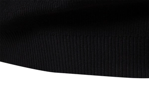 Close-up of premium black ribbed knit fabric and texture on a men's business sweater