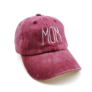 Close-up of MOM 3D embroidery on washed cotton baseball cap with stitch detail