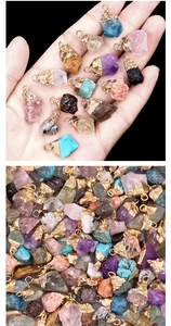Close-up of assorted natural crystal agate pendants with gold electroplated caps and loops