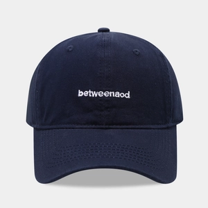 Navy blue cotton baseball cap with white letter embroidery and six-panel structure