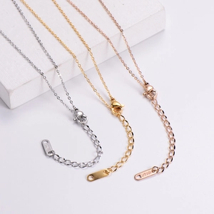 Detailed close-up of adjustable necklace chains with lobster clasps in gold silver rose gold