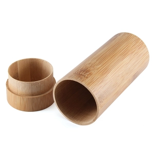Natural cylindrical bamboo sunglasses case with eco-friendly wood texture and lid