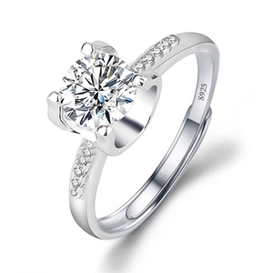 Close-up of S925 sterling silver ring featuring a round cut solitaire and pavé stones