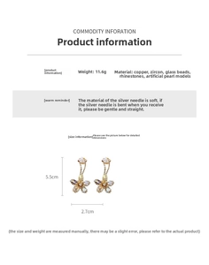 Macro shot of flower earrings with zircons and pearls showing 5.5cm x 2.7cm dimensions