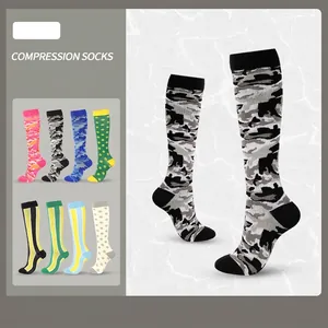 Colorful long compression socks in various patterns like camo, dots, and stripes