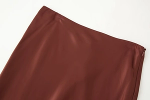 Detail of satin midi skirt showing waistline and side invisible zipper closure