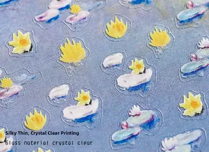 Detailed view of ultra-thin transparent floral art nail stickers with glass texture finish