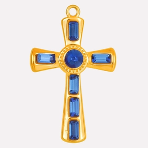 Detail of gold cross pendant with blue gemstones and polished stainless steel finish