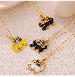 Detailed view of colorful elephant pendants with crystals on gold-plated chains