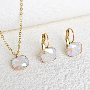 Detailed view of square iridescent zircon stones set in gold plated stainless steel