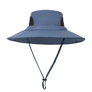 Blue outdoor sun protection bucket hat with wide brim, mesh vents, and chin strap