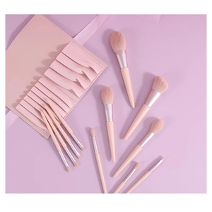 Flat lay detail of pink marble makeup brush set with matching portable PU storage bag