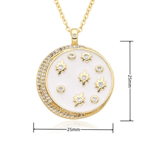Macro detail of 25mm gold moon pendant with white enamel and sparkling star crystals