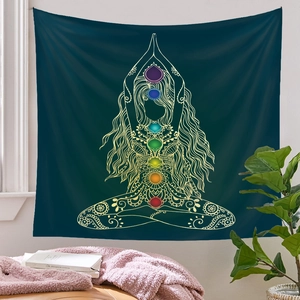 Detail of green meditation tapestry featuring golden seven chakra female silhouette