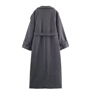 Rear view of a long dark grey wool blend coat featuring a waist belt and sleeve straps