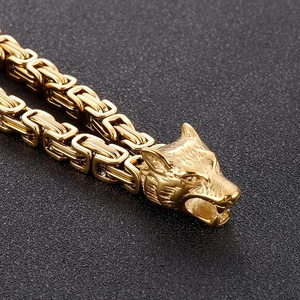 Detailed view of golden Byzantine chain bracelet featuring intricately carved wolf heads
