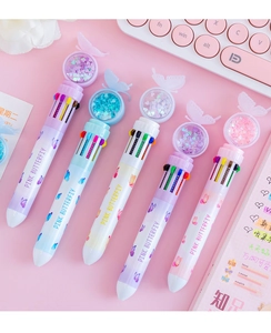 Detailed macro view of multi-color butterfly pens with 10 refill options and cute 3D toppers