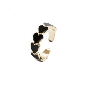 Adjustable gold plated open ring featuring a continuous black enamel heart pattern