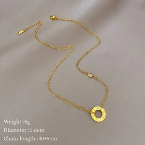 Close-up of gold LOVE ring necklace pendant with dimensions 1.6cm and chain 40+5cm