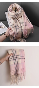Detail of pink and beige plaid scarf with soft tassels and high-quality cashmere feel
