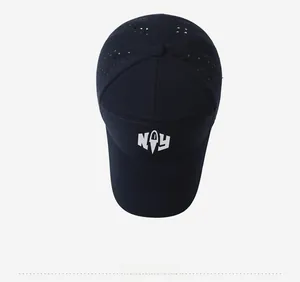 Top view of navy blue baseball cap showing laser-cut ventilation holes and NAY logo