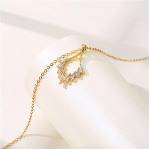 Elegant gold geometric necklace with rectangular zircon on white display stand