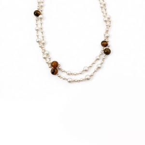 Double-layered tiger eye and pearl necklace with golden chain in vintage elegant style