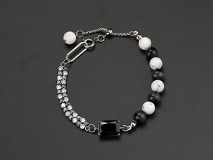 Macro shot of hip-hop titanium steel bracelet with natural stone and pavé rhinestones