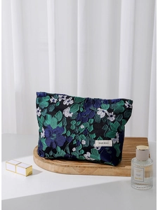 French vintage jacquard makeup bag with floral patterns on a rustic wooden tray