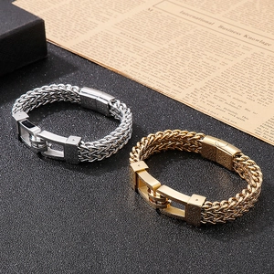 Detailed view of silver and gold woven metal chains for men with industrial buckles