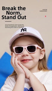 Pink rectangular frame baby sunglasses with dark grey lenses worn by a little girl