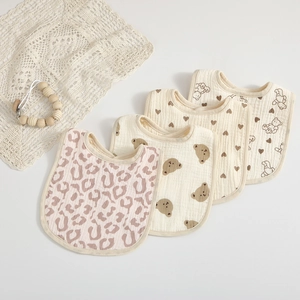 Set of 4 soft organic cotton gauze baby bibs with cute bear and heart print patterns