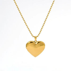 Polished golden heart-shaped locket pendant necklace with a delicate bead chain