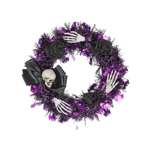 Halloween wreath with purple and black tinsel, white skulls and black roses for door decor