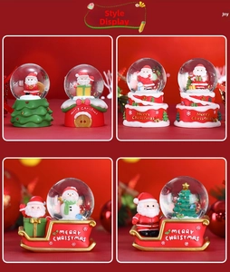 Detail of Christmas crystal ball decorations showing Santa Claus and holiday designs