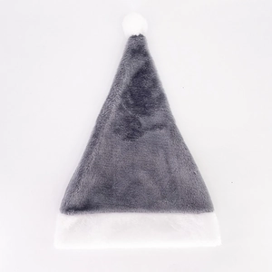 Detail of gray plush Christmas hat featuring a white faux fur pompom and soft trim