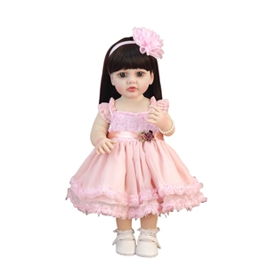 Lifelike 55cm reborn girl doll with long black hair in a pink lace floral dress