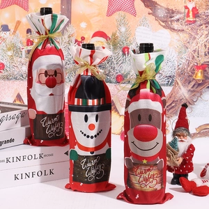 Three Christmas wine bottle covers with Santa, Snowman, and Reindeer cartoon patterns