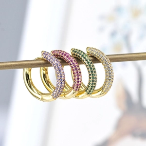 Elegant gold hoop earrings with multi-color cubic zirconia stones in a row display