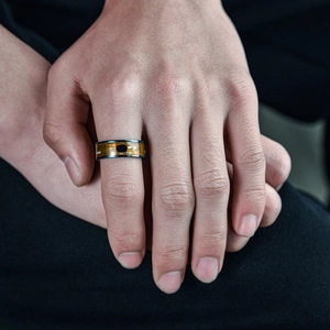 Smart NFC ring with circuit board pattern and metal edges worn on the index finger