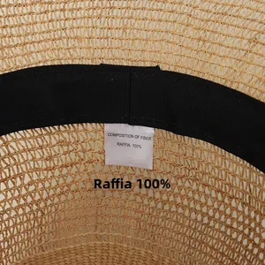 Macro shot of 100% Raffia sun hat interior showing sweatband and fiber composition label