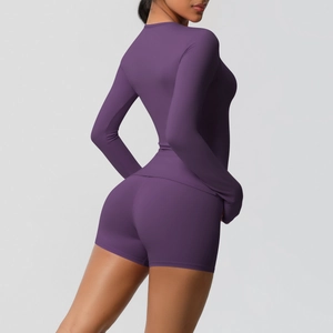Detail view of purple brushed yoga set featuring long sleeve top and high waist shorts