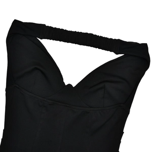 Close-up of the back strap detail and ruched fabric on this black tube dress