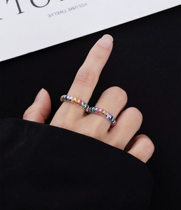 Detail of 925 silver 14k gold rings with multi-color rectangular zircon stones
