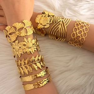 PVD gold plated stainless steel open bangles with floral and geometric cutout designs
