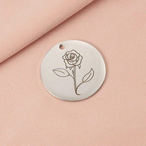 30mm silver rose engraved round pendant necklace charm on soft pink fabric background
