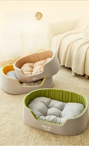 Λεπτομέρεια από τρία μαλακά κρεβάτια κατοικίδιων σε κίτρινο, μπεζ και πράσινο με Good Luck